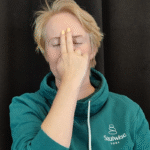 Woman doing breathing exercise.